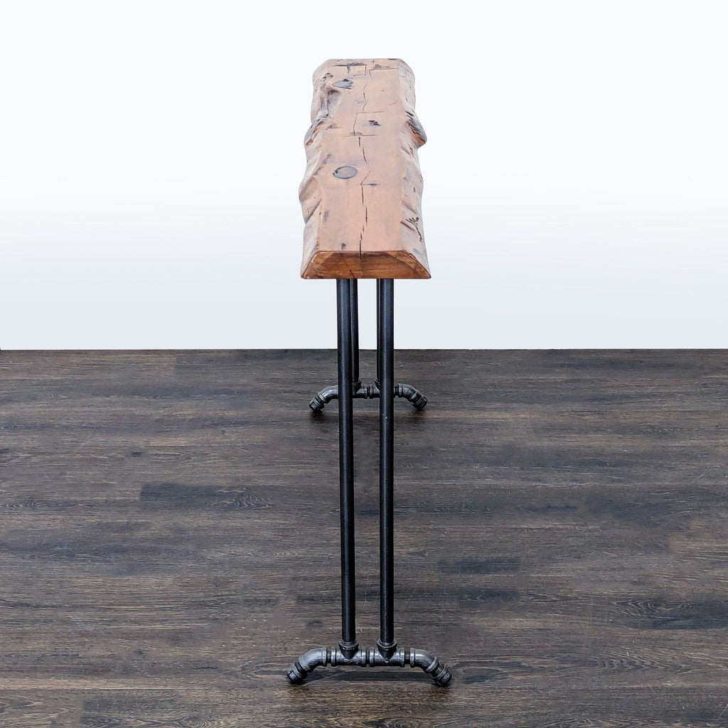 3. Slim side table with a rugged wooden surface and sturdy metal pipe frame, viewed from the narrow end.