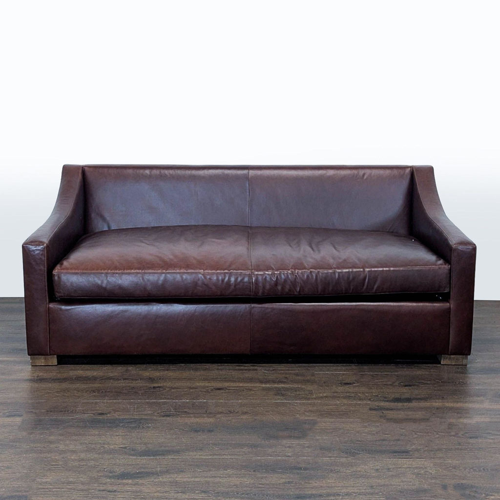 Brown leather 3-seat sofa by Sugarhill Custom Upholstery with modern design, sloped arms, and wooden feet.