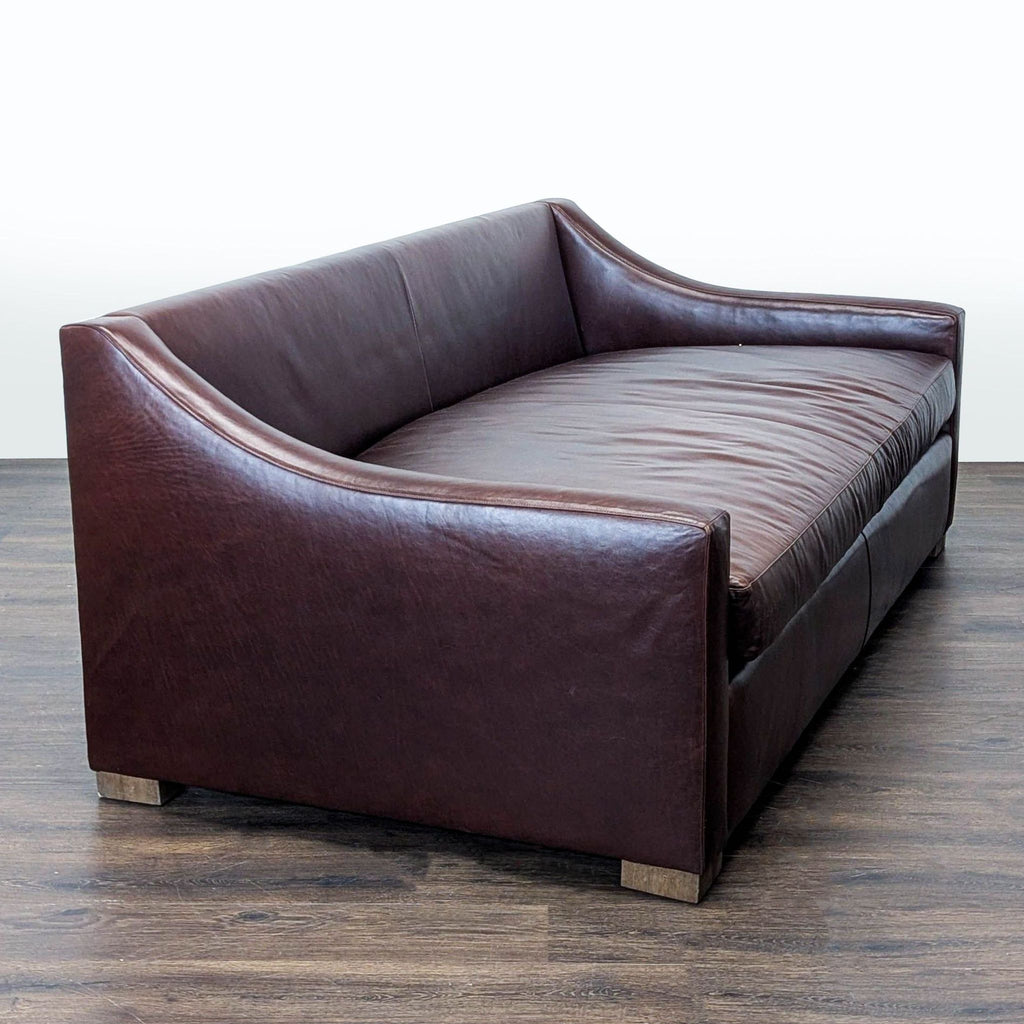 Elegant Sugarhill 3-seat brown leather sofa featuring wide cushioned seats and sleek, gently sloped armrests.