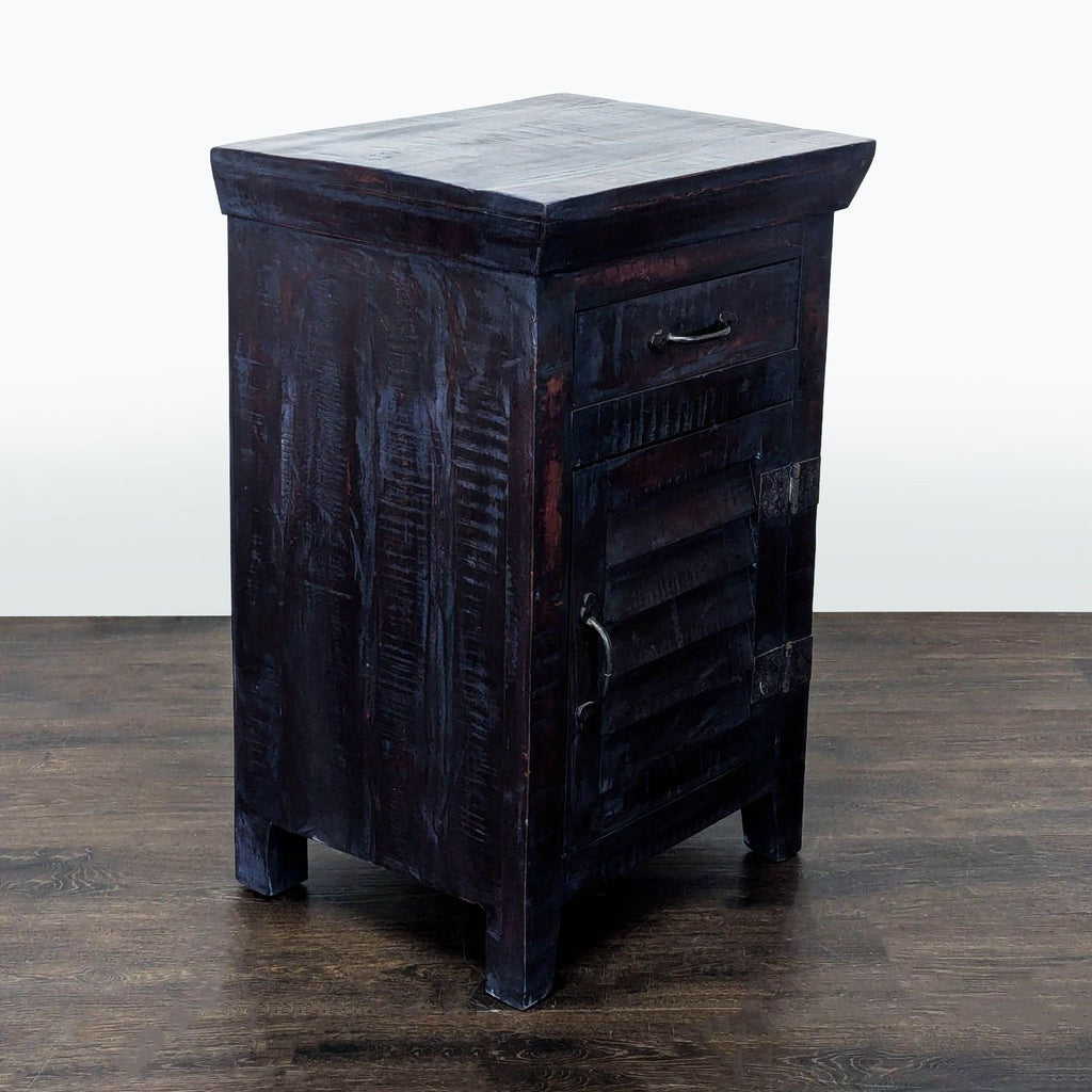 Wooden end table with vented Louvre door and handy cabinet shelf inside for extra storage.