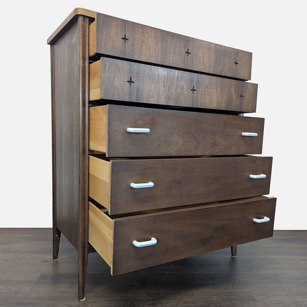 Vintage Broyhill wood dresser featuring sleek design, metal handles, and spacious five-drawer organization.
