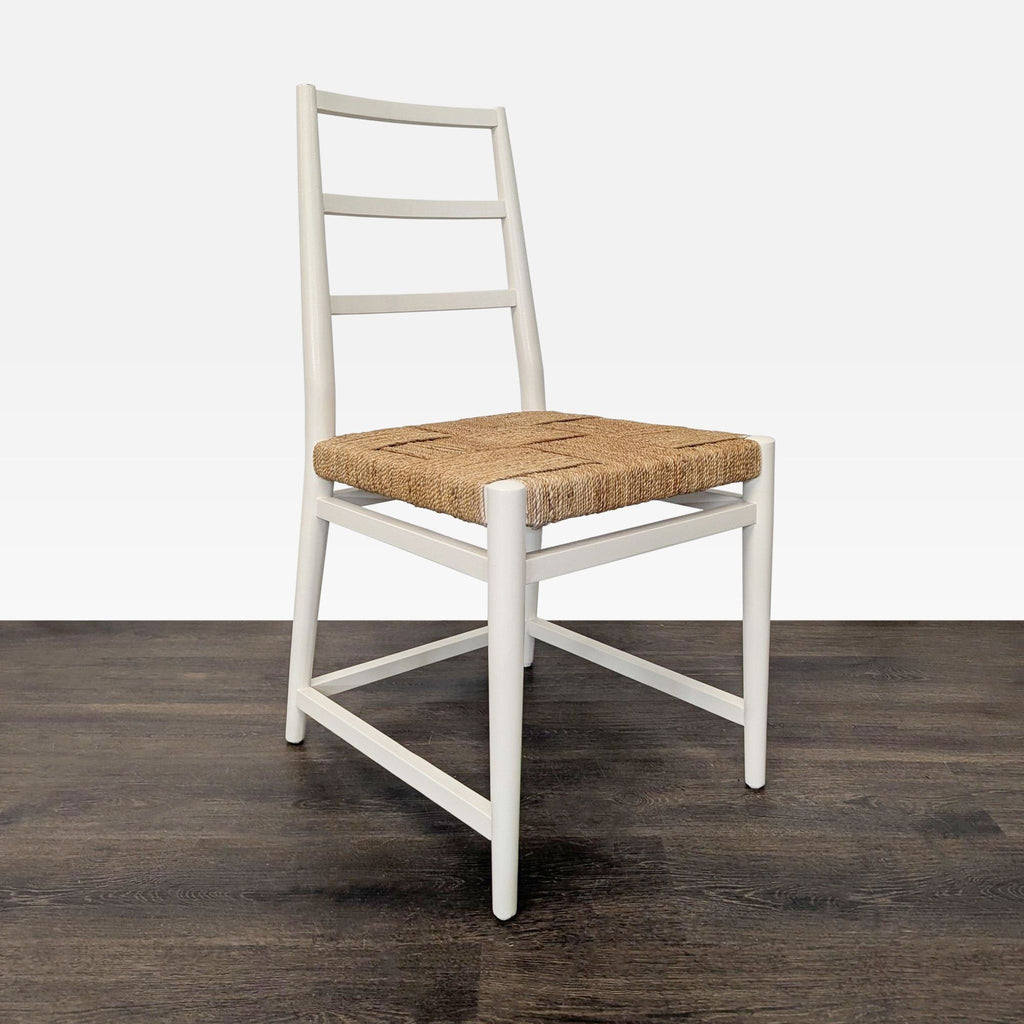 Single white dining chair with a woven natural fiber seat, shown from an angled side view.
