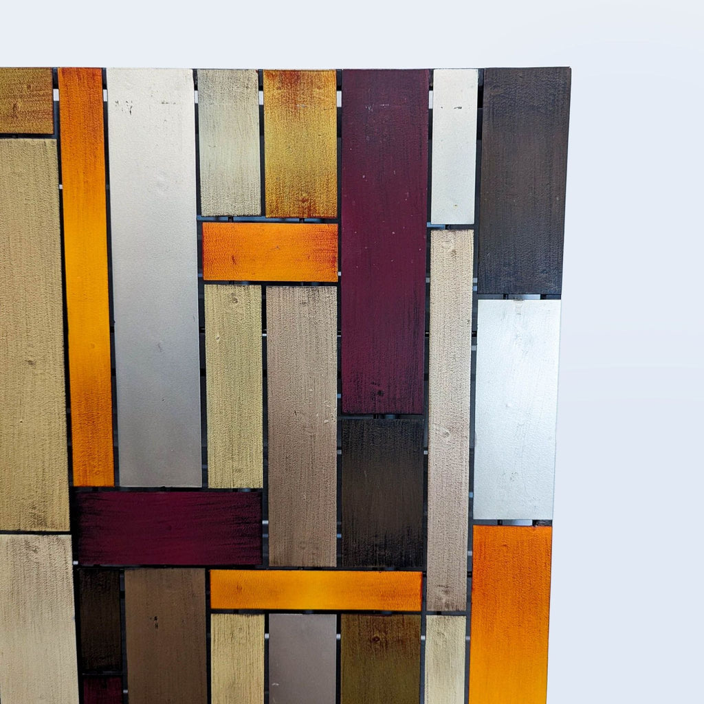 Close-up of the Pier 1 Imports mirror frame with a geometric pattern in multicolored wood panels.