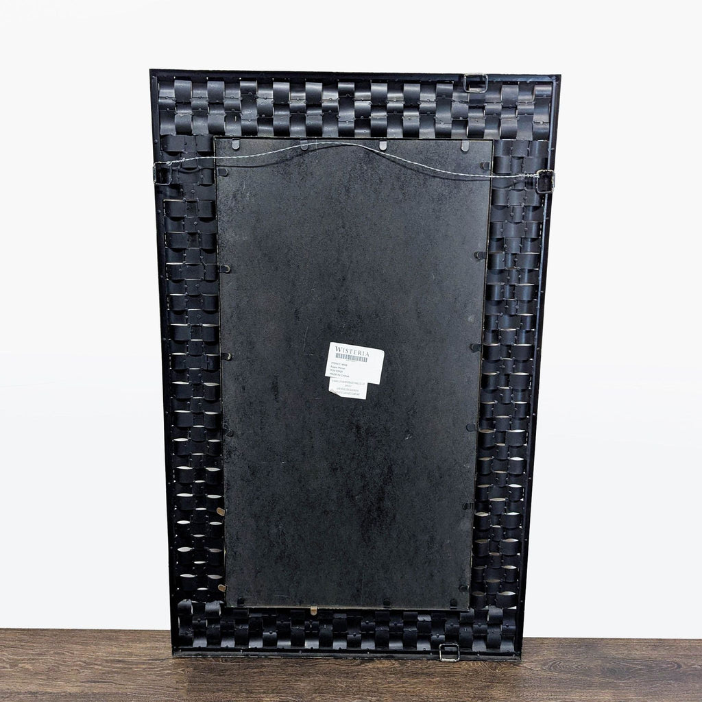 2. Decorative Wisteria brand mirror featuring intricate details, perfect accent for any stylish space.  