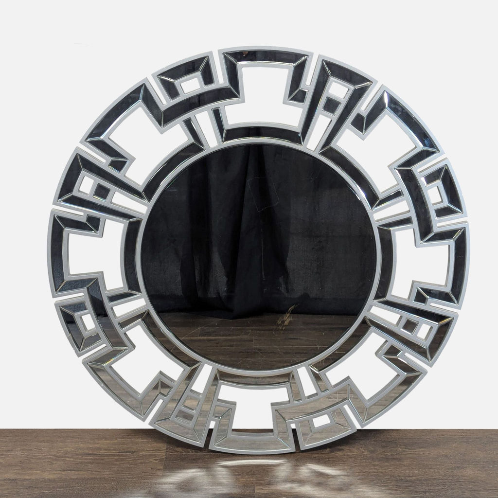 Mirror with a geometric wooden frame and glass accents around the central reflective surface.  