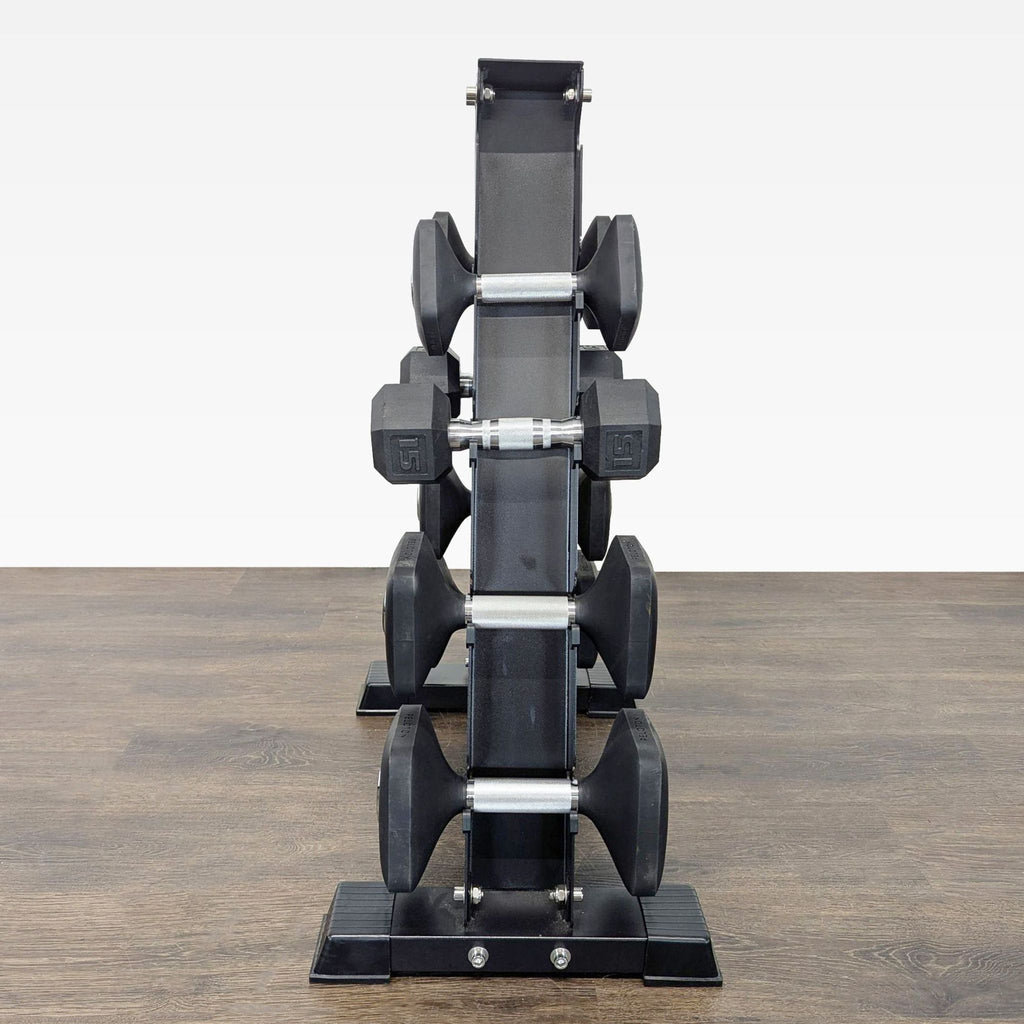 Peloton-branded dumbbells and rack; set includes five pairs of easy-grip weights for home strength training.
