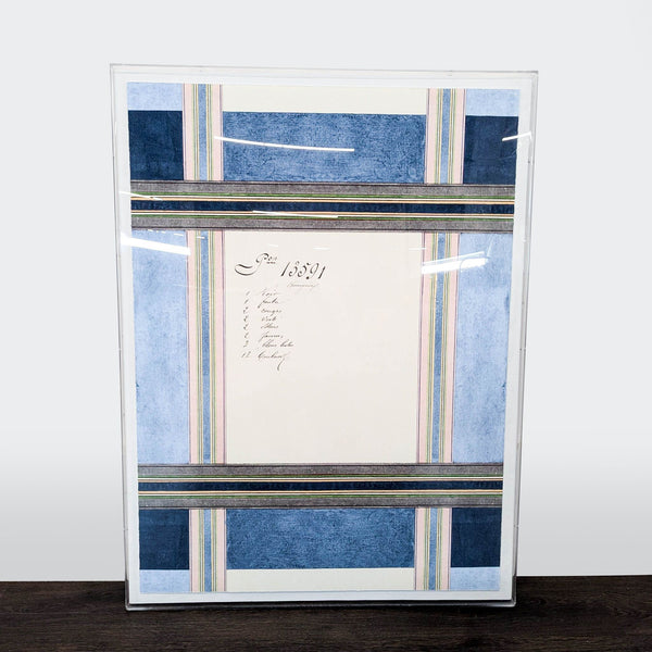Large abstract art with navy, blush, green, and gray plaid layers and French script, floating in an acrylic frame.  