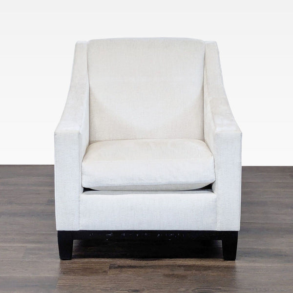A. Rudin luxury lounge chair in ivory textured fabric, dark wood base, and modern tailored silhouette.