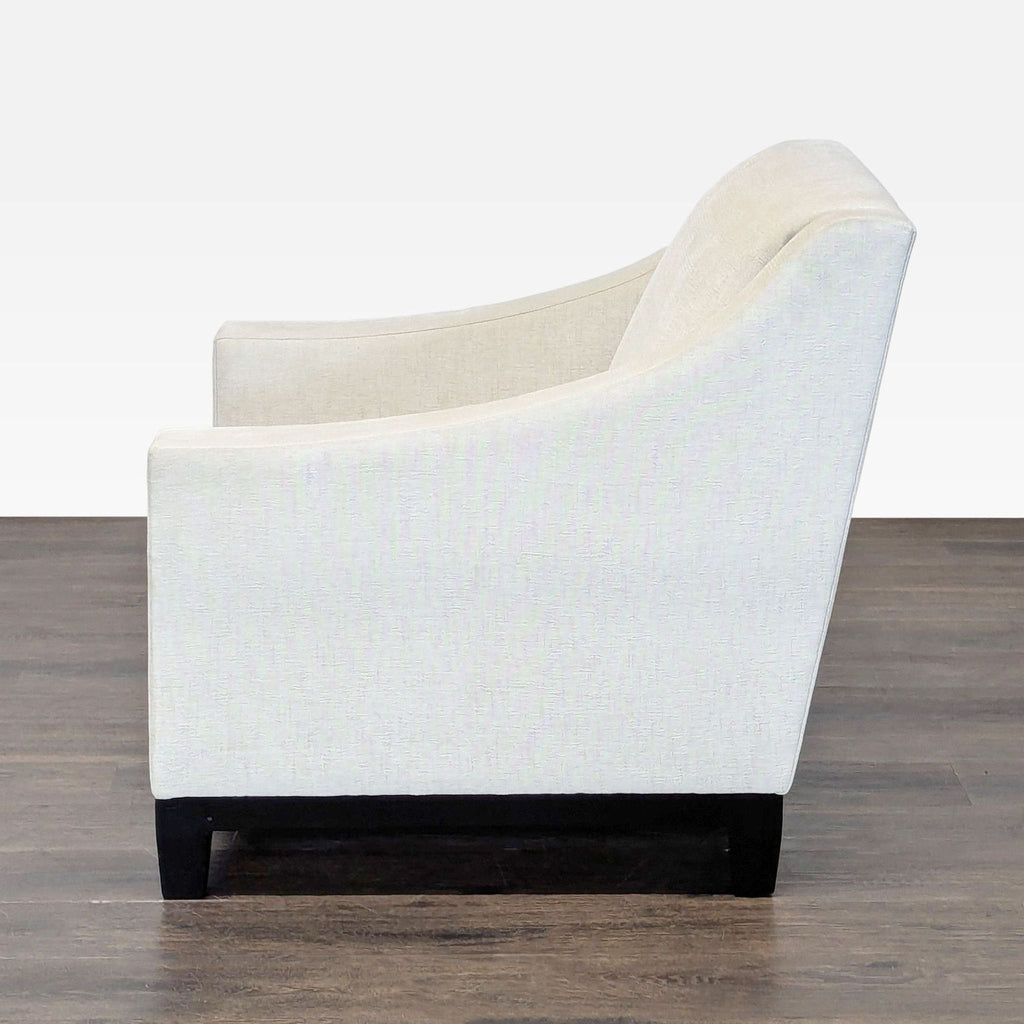 Contemporary A. Rudin lounge chair, upholstered in textured ivory fabric with premium cushioning and sleek design.