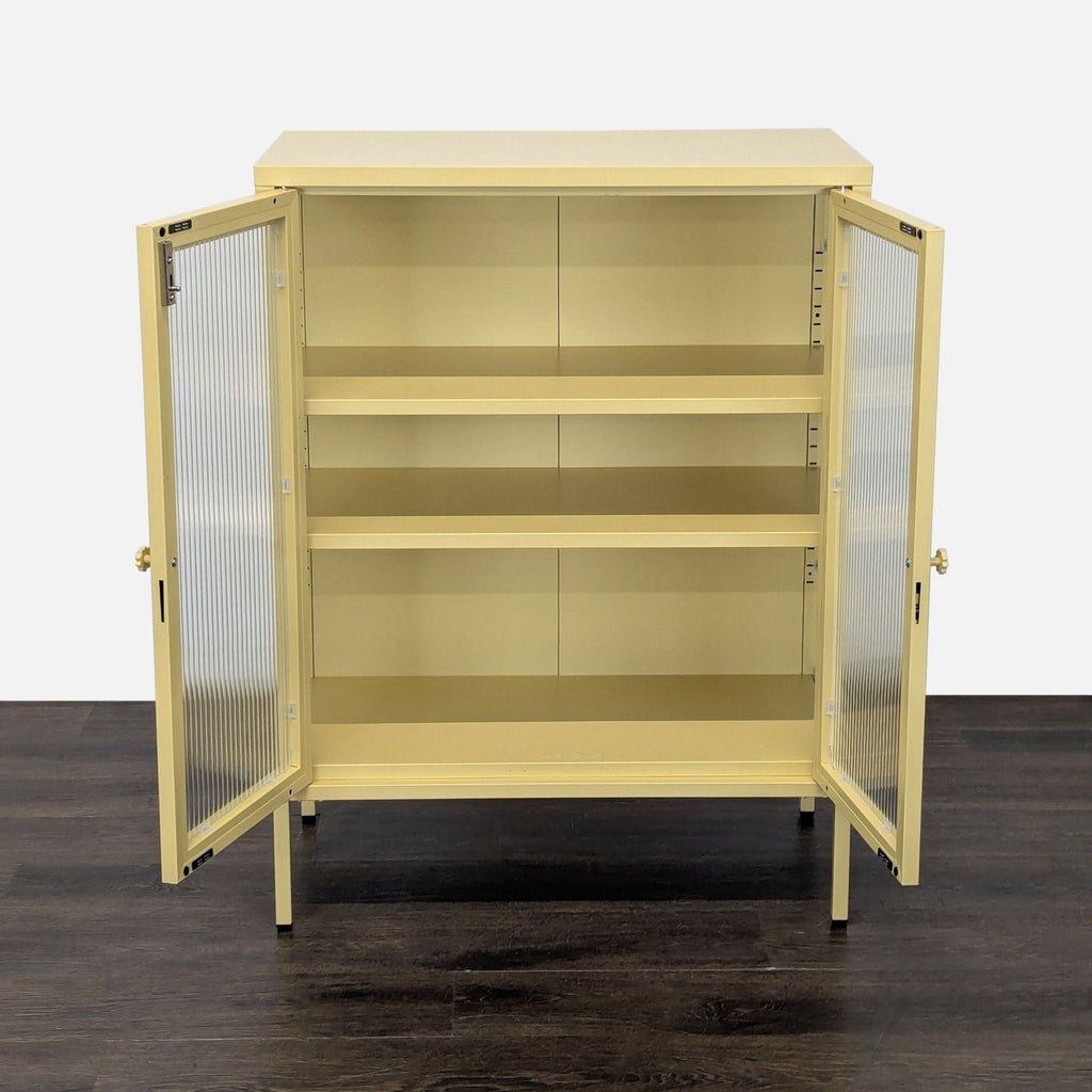 Modern Mustard cabinet featuring glass-fronted doors, steel frame, and adjustable shelving.  