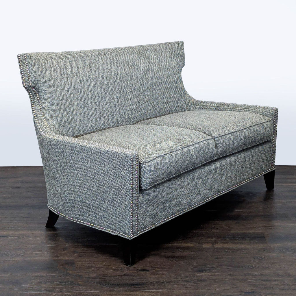 Modern grey Thomasville loveseat featuring decorative nailhead accents and clean-lined silhouette for small spaces.