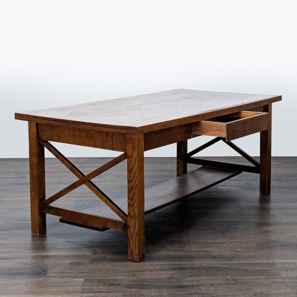 2. Wooden dining table featuring an open drawer, X-frame legs, and a bottom shelf, on a wood floor.