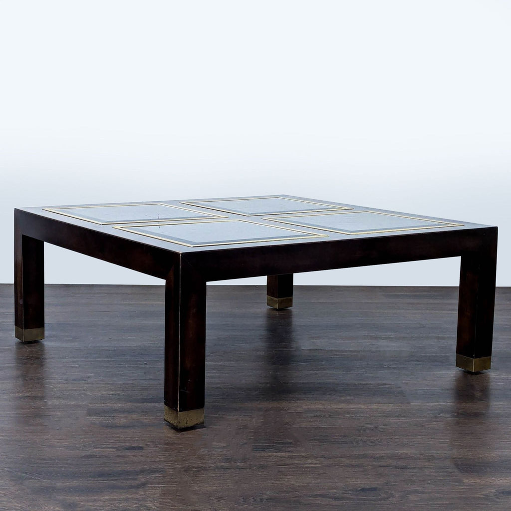 1. Square coffee table with wood frame, metal capped legs, and four glass panels on top.  