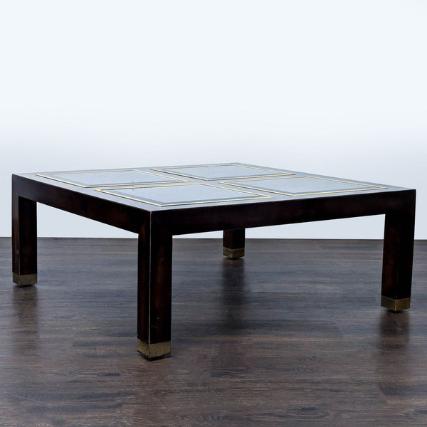 1. Square coffee table with wood frame, metal capped legs, and four glass panels on top.  