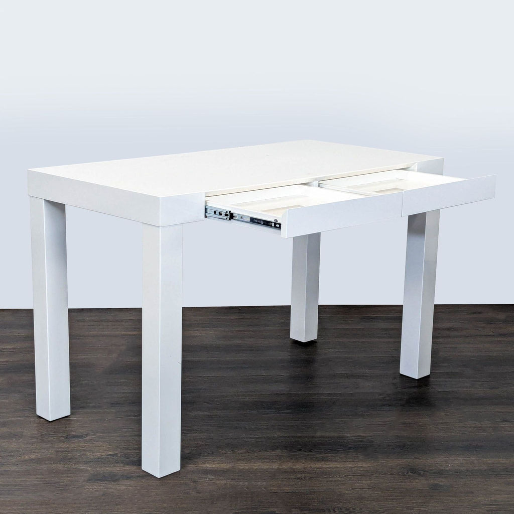 Sleek white West Elm desk featuring clean lines, dual drawers, and a compact, contemporary style.  