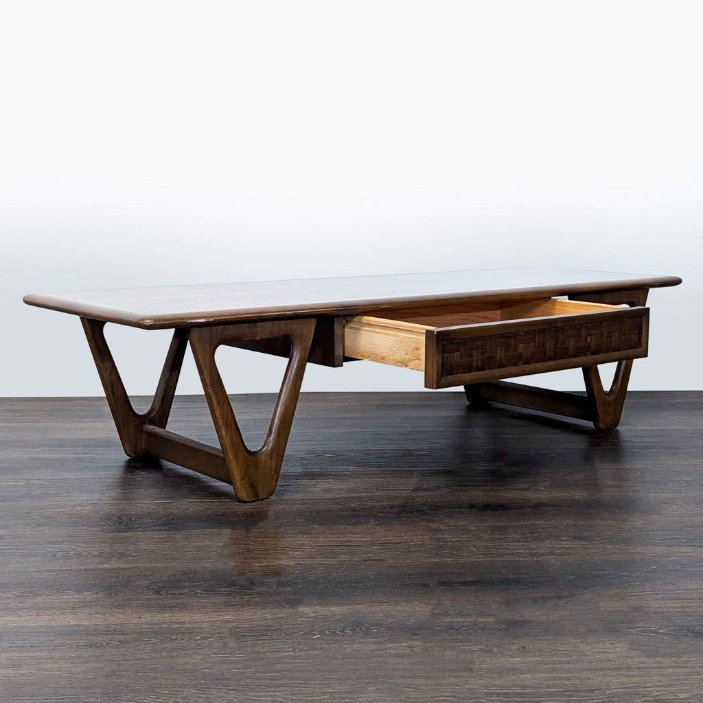 1970s Lane walnut coffee table featuring a textured drawer and classic mid-century modern design.