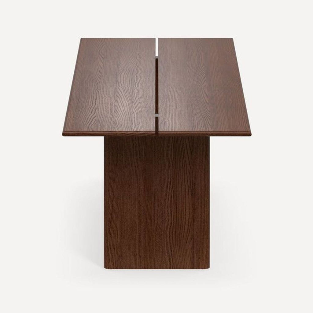 Burrow Furniture dining table with a water- and scratch-resistant walnut finish, fits up to six people.