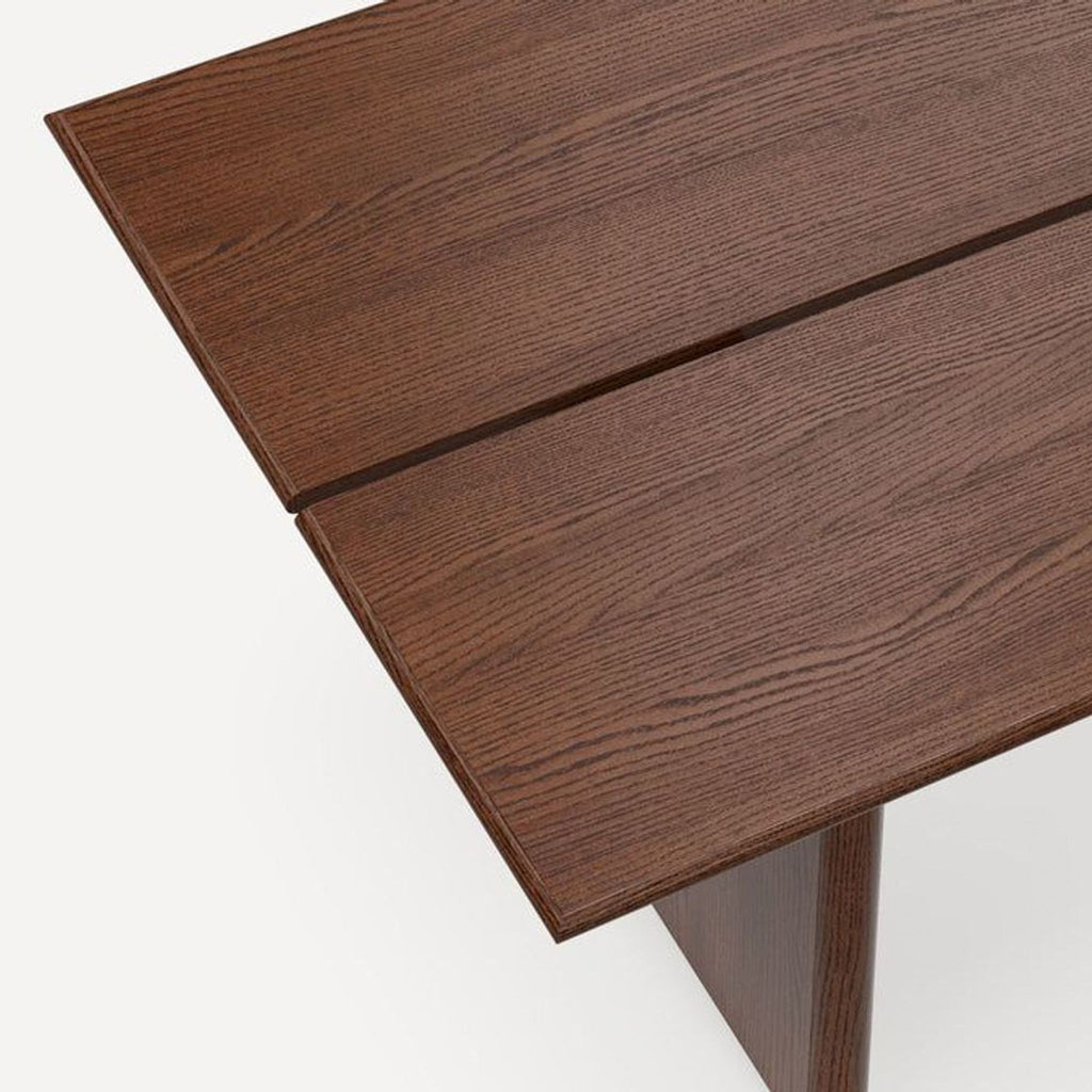 Sleek slab-style walnut table from Burrow, designed for dining, sturdy build for seating six.