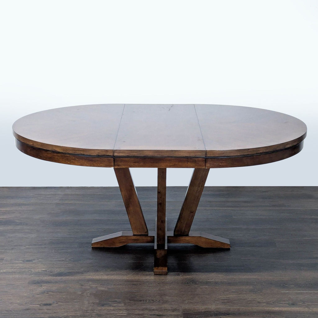Legacy Classic dining table with extendable design, saddle brown finish, for 4–6 people.  