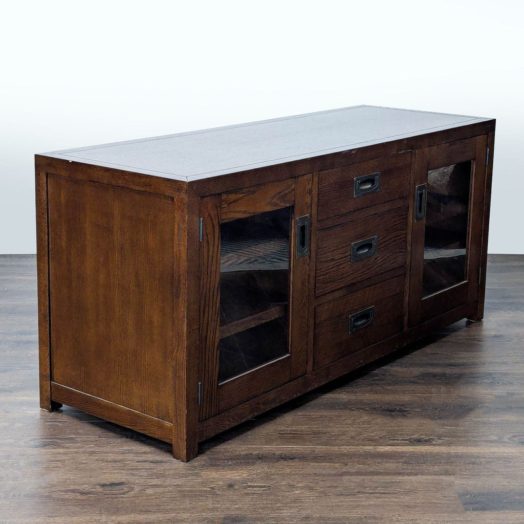 Entertainment center in mission style; includes glass cabinet doors, three drawers, and shelving, Restoration Hardware.