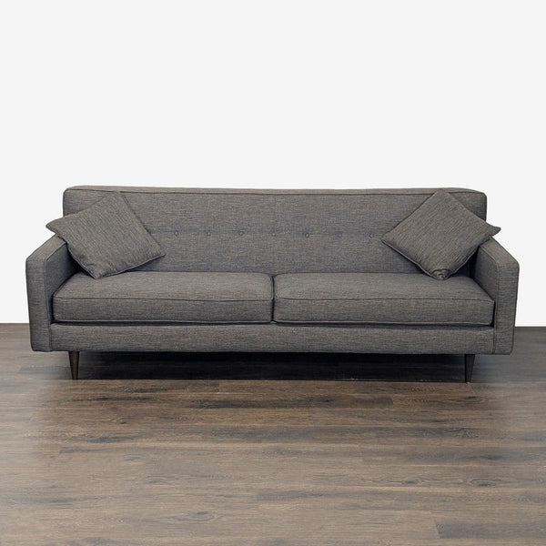 Modern dark grey 3-seat sofa with button back, two cushions, and wooden legs, ideal for living rooms.