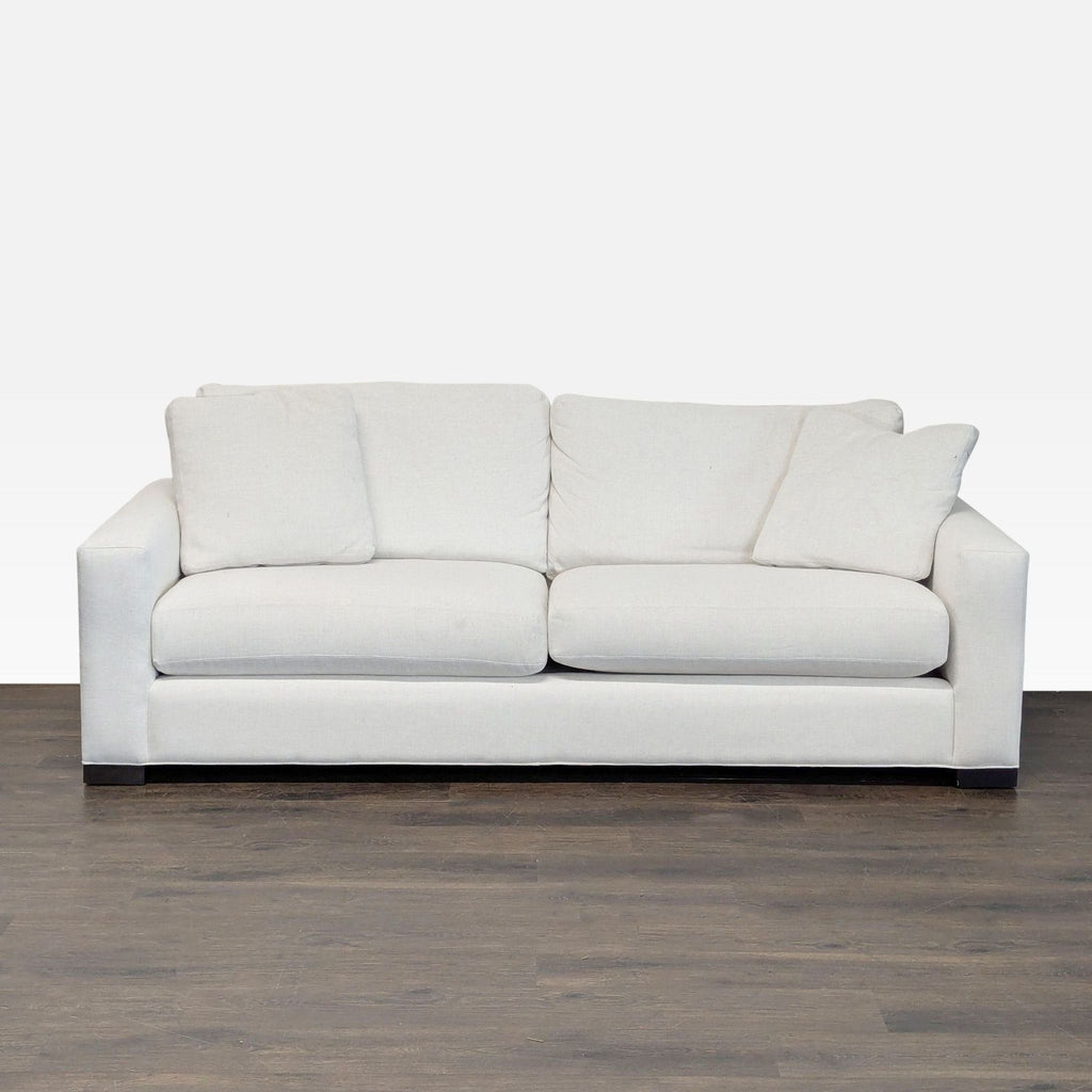 1. Front view of a Room & Board 3-seat modern sofa with light fabric upholstery and plush cushions.