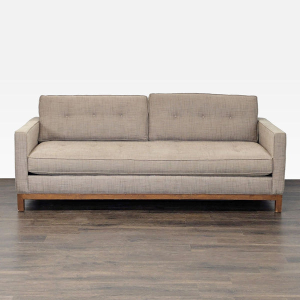 Tan modern sleeper sofa with straight arms, button-tufted back, and wooden base, perfect for living rooms.  