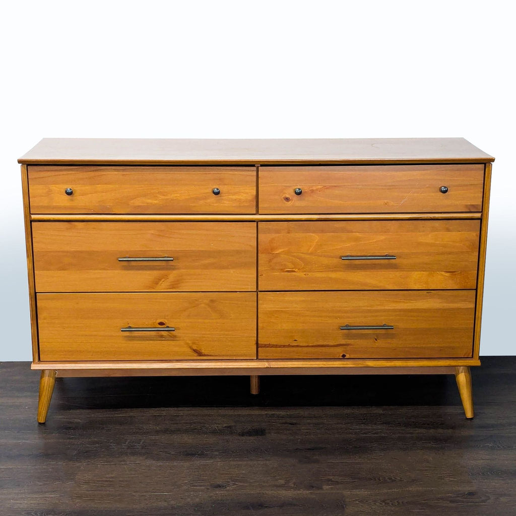 1. AllModern mid-century dresser with six drawers, metal handles, and solid legs, finished in natural wood.