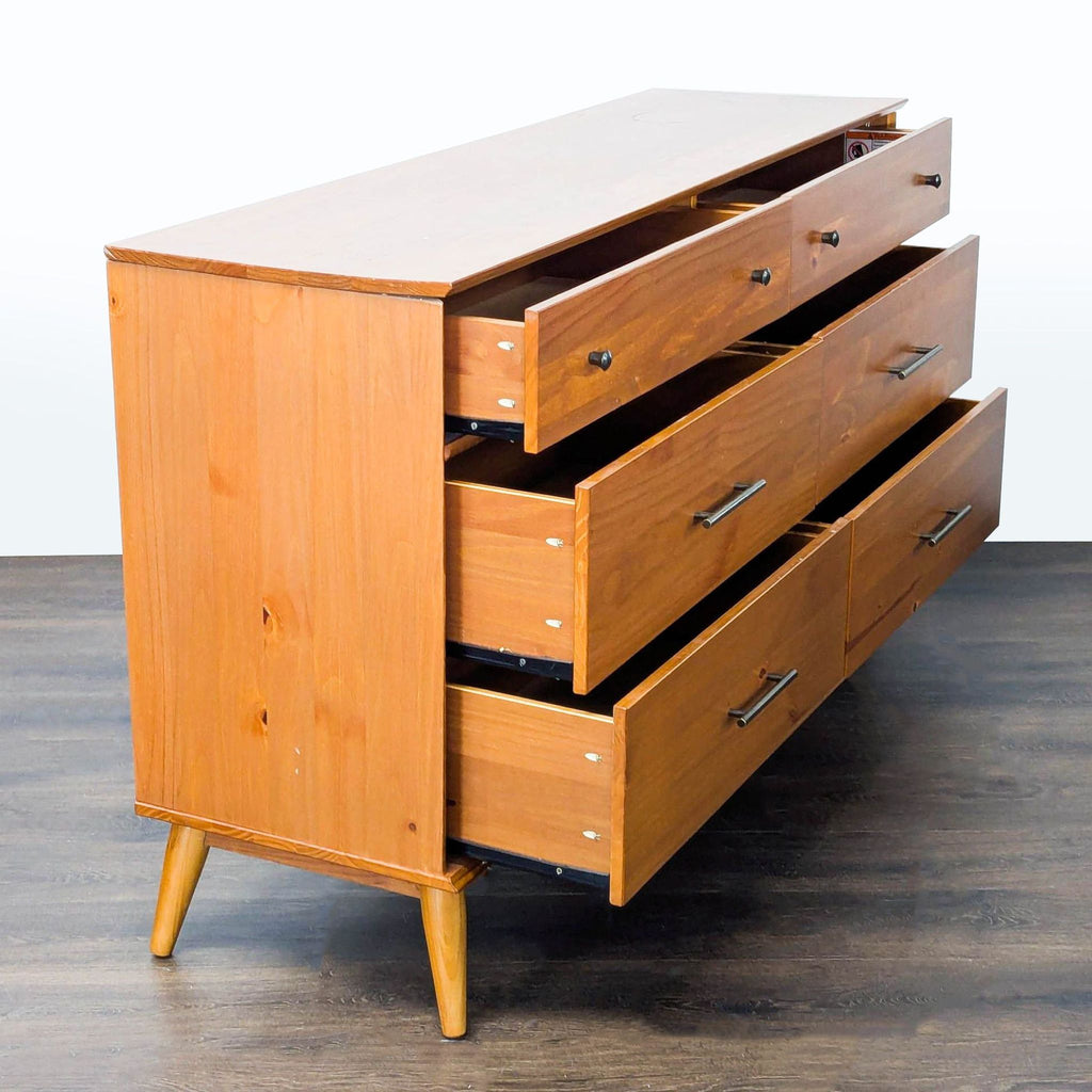 2. Side view of an AllModern dresser showing open spacious drawers and sturdy mid-century modern design.