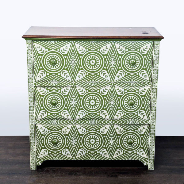 Pottery Barn dresser with green and white geometric pattern and three drawers for stylish storage.