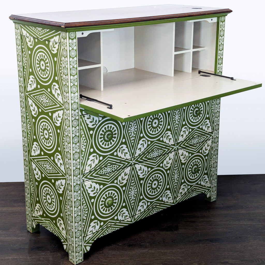 Green and white geometric Pottery Barn dresser featuring three spacious drawers and sturdy wood frame.