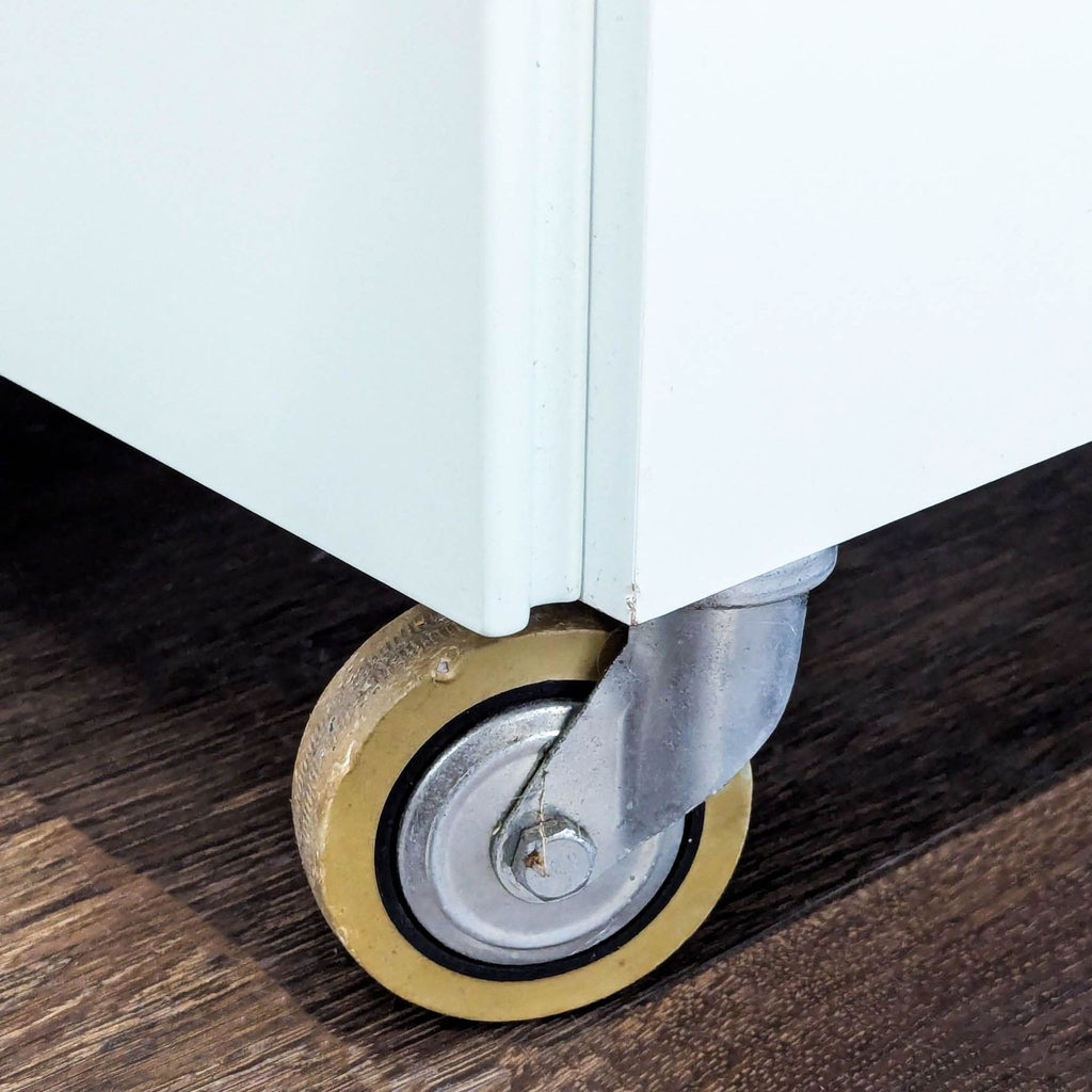 Modern White 4-Drawer Dresser with Frosted Top Drawer and Wheels