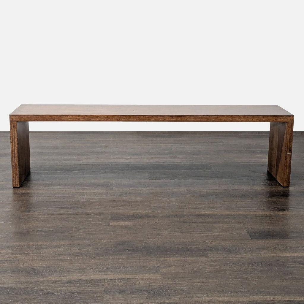 1. Modern wooden bench with clean lines, showcased on a dark wood floor, belonging to Stools, Ottomans & Benches.