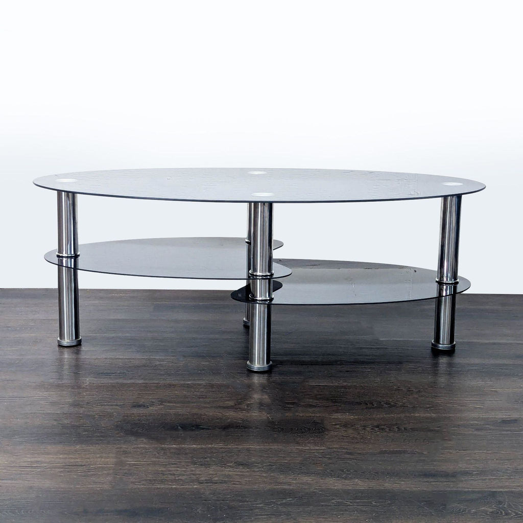 1. Modern oval glass coffee table with chrome legs and two shelves, displayed on a dark wood floor.