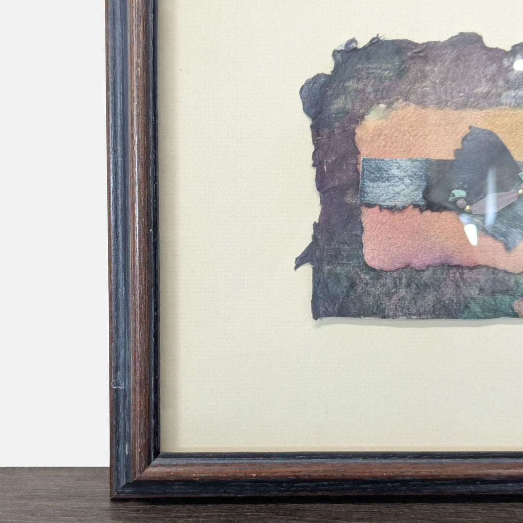 3. Close-up of dark wooden frame and abstract art details, showing textured paper and small decorative beads.