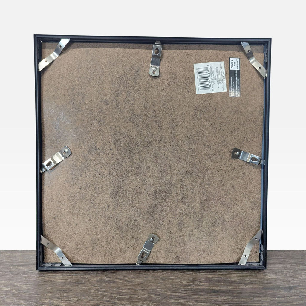 3. Back view of the framed artwork showing hanging hardware and product label; suitable for wall display.