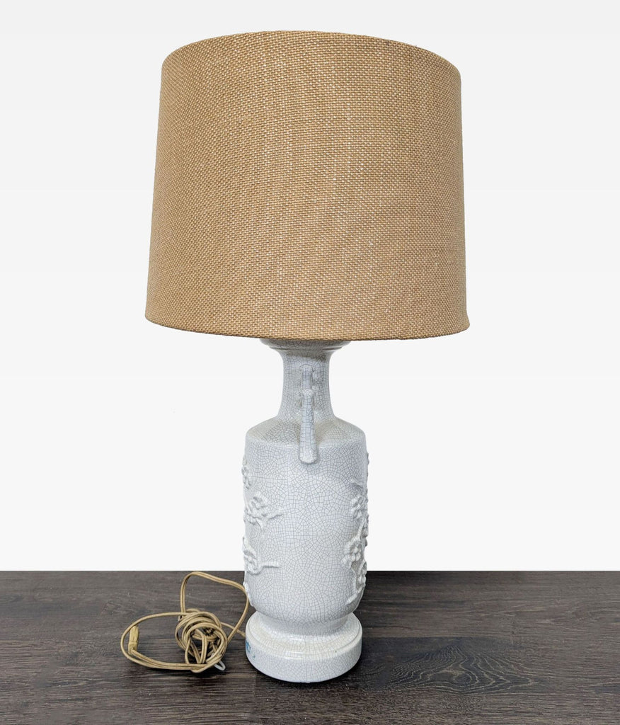 Ceramic lamp with floral crackle base and beige textured shade, suitable for any room décor.