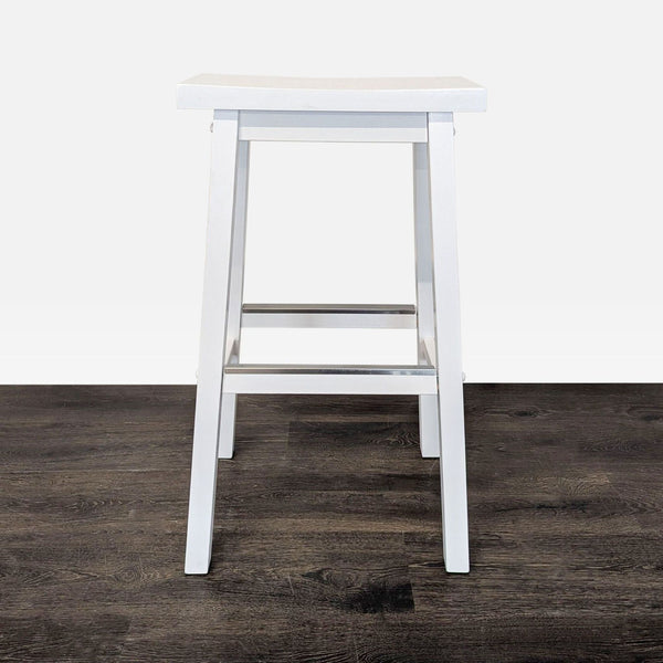 Sleek metal footrest with a minimalist rectangular design, suitable for modern settings.  