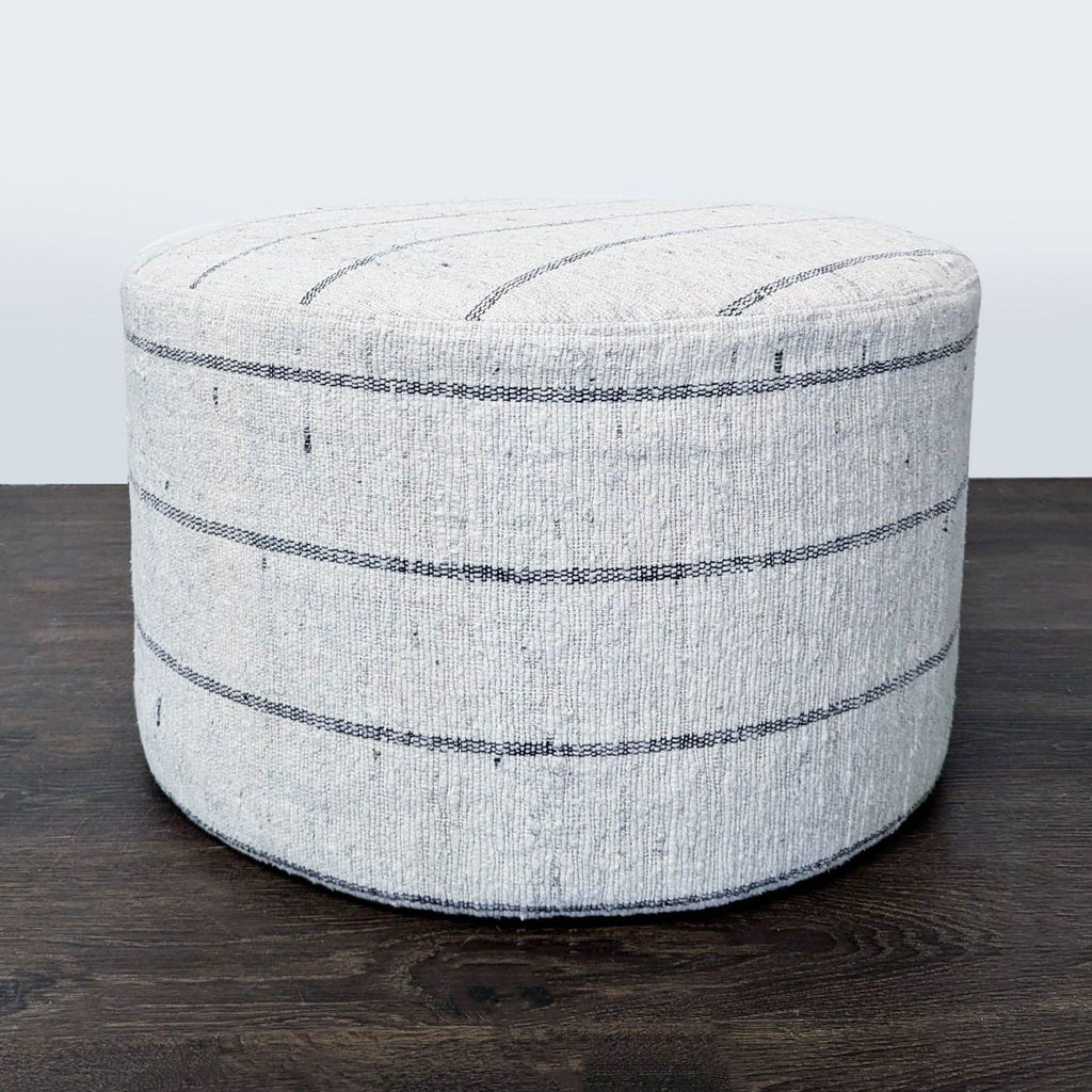 Modern ottoman by The Citizenry featuring subtle stripe design and artisanal Indian craftsmanship.