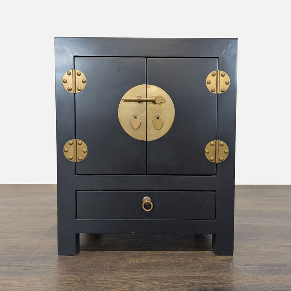 Glossy lacquered cabinet with sleek brass handles, standing alone against a white background.