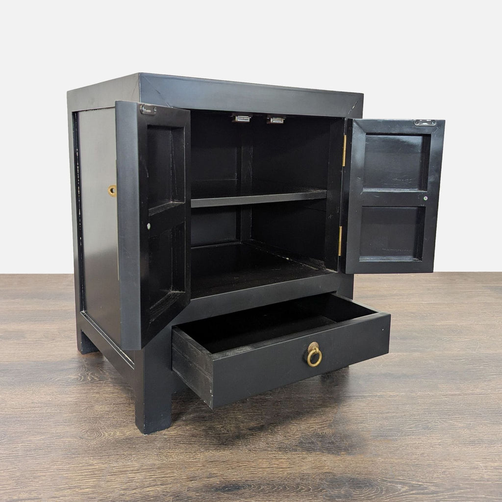 Modern lacquered cabinet featuring polished brass hardware on doors and drawers, cabinet category.