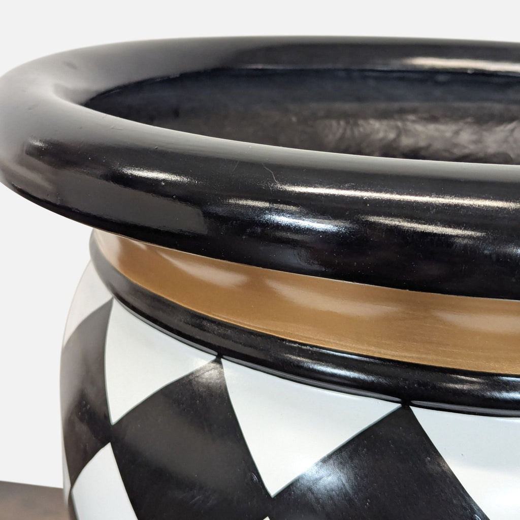 Black and white harlequin patterned vase with gold trim from MacKenzie-Childs, categorized under Vases.