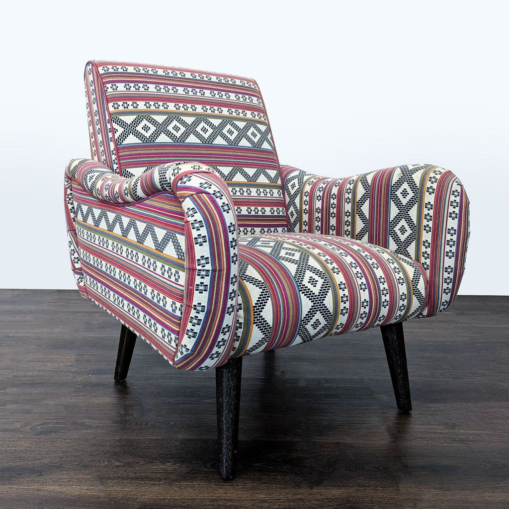 2. Angled view showing Cost Plus lounge chair's padded armrests and bold multicolored geometric upholstery.