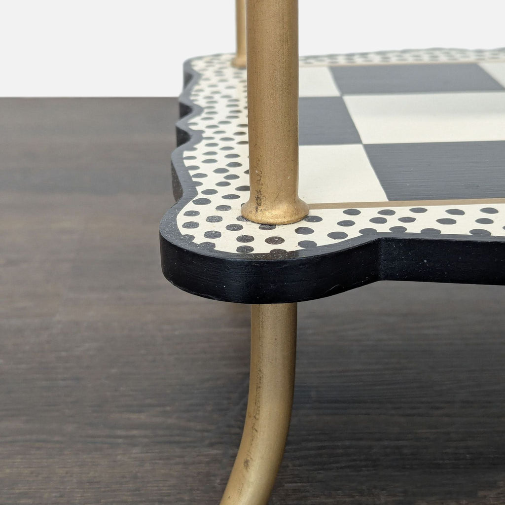 Engineered wood and iron object by MacKenzie-Childs painted with whimsical checkered, dotted, and striped patterns.