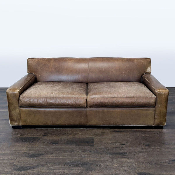 Mitchell Gold 3-seat brown leather sofa with wide arms, classic style, and visible vintage wear.