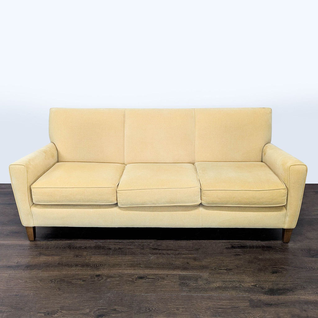 Light beige Room and Board 3-seat sofa with clean lines, wooden legs, and modern style in good condition.