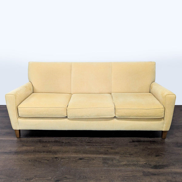 Light beige Room and Board 3-seat sofa with clean lines, wooden legs, and modern style in good condition.