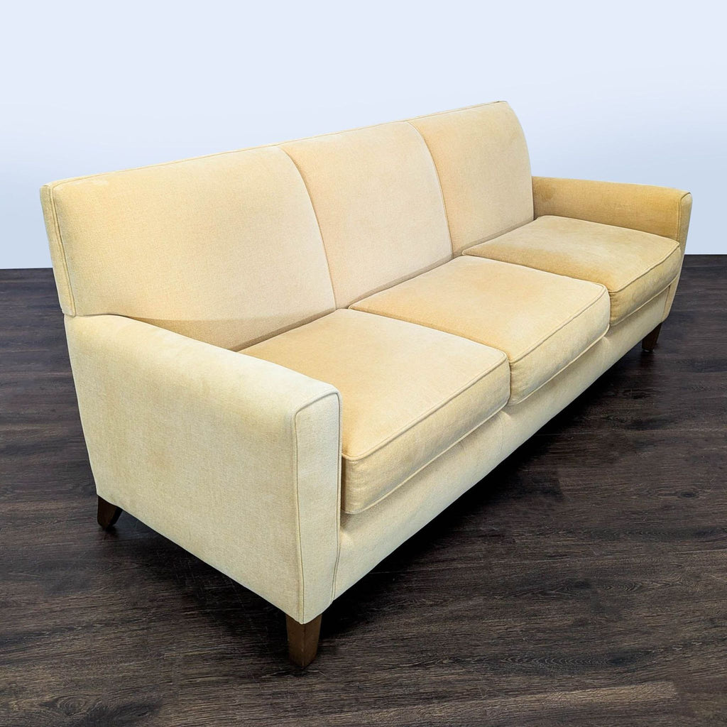 Modern Room and Board sofa, seats 3, features simple beige upholstery and sturdy wood legs, gently used.