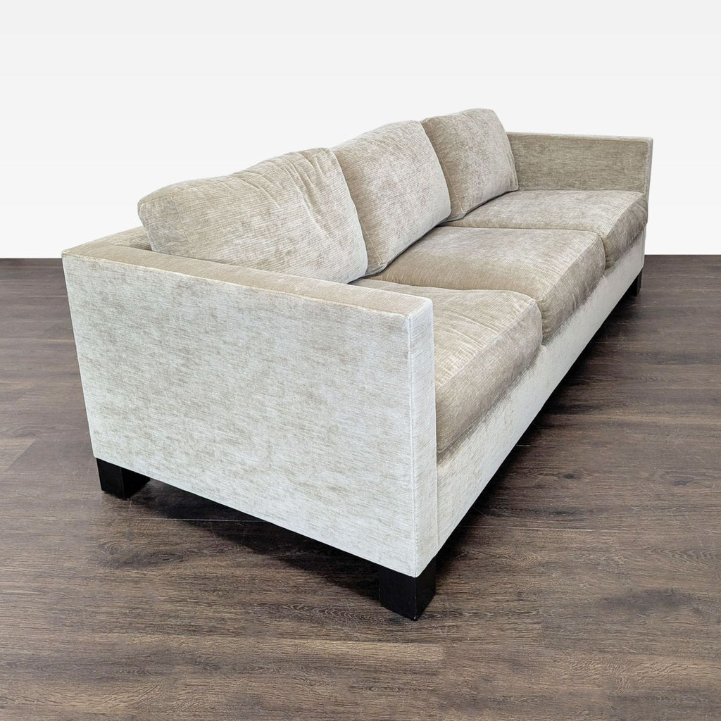 2. Angled side view of A. Rudin 3-seat sofa showing plush cushions and modern, neutral fabric design.  