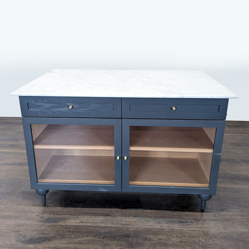 Anthropologie kitchen island with glass doors, marble surface, and elegant blue finish for modern kitchens.